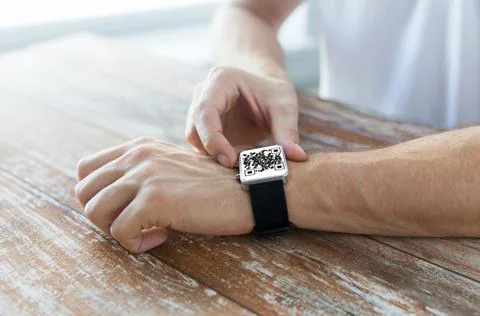 Male hands with qr code on smart watch 스톡 사진