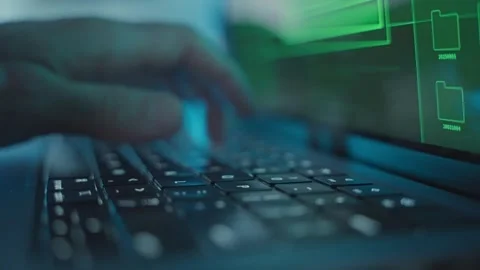 Male hands quickly typing and coding on laptop computer in dark office desk Stock Footage 340234049