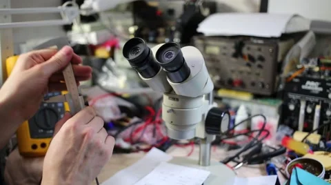 Male hands with ruler and microscope among many tools Vidéo 51874441