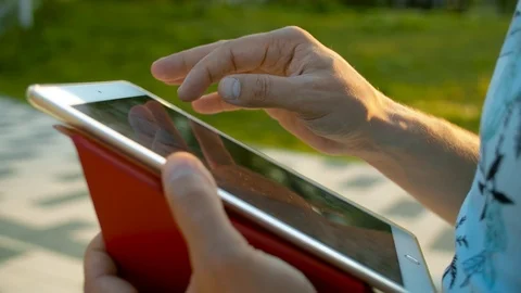 Male hands scrolling the tablet Video stock 114624232