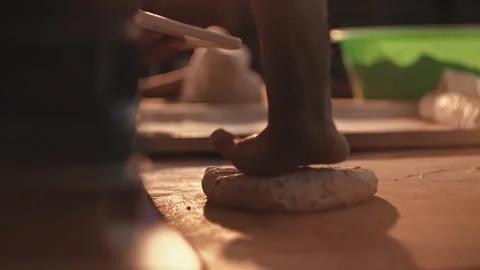 Male Hands shaping dough for bread and rolls production on wooden table inside Stock Footage 344844492