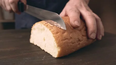 Male hands slicing bread, close-up. Stock Footage 148282127