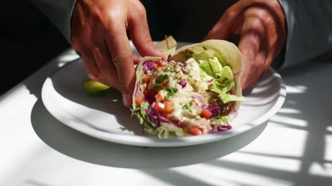 Male hands taking vegetable roll from plate Stock Footage 265988175