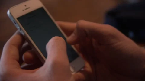 Male hands text messaging on an iPhone Stock Footage 68106364