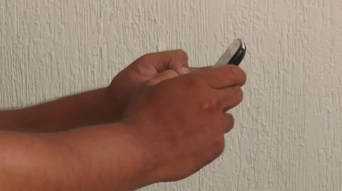 Male hands texting or typing on a touchscreen stphone. Man Presses Themar Phone. Stock Footage 50539952