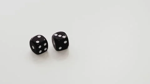 Male hands throwing double dice on white table. Two and three on dice cubes at Stock Footage 141567894