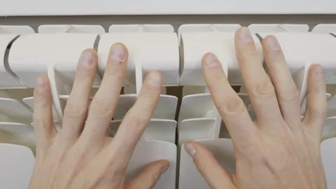 Male Hands Touching White Central Heating Radiator To Check Warmth Stock Footage 329484279