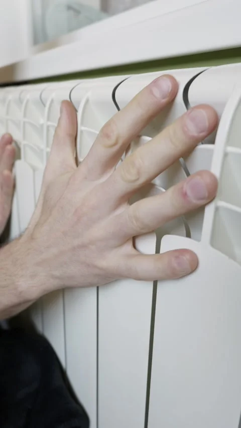Male Hands Touching White Radiator To Check Heating Temperature Indoors Stock Footage 329484086