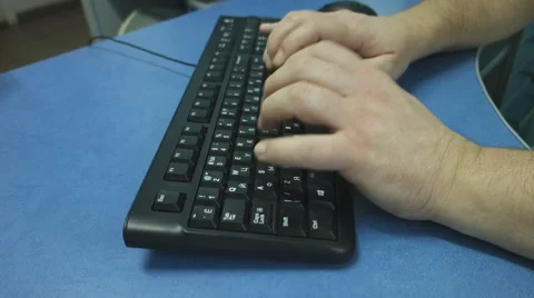 Male hands typing on a black computer keyboard Stock Footage 67847128