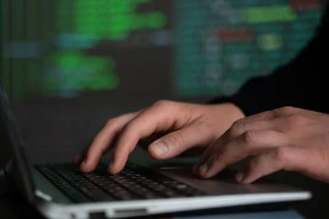 Male hands typing computer code, security program for database or servers Stockfoto's