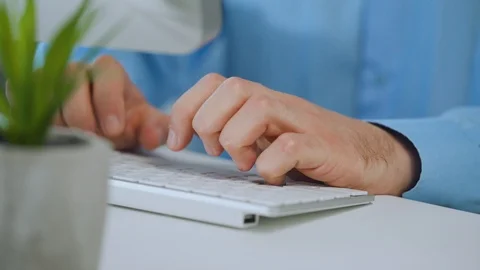 Male hands typing on a computer keyboard Stock Footage 120757126