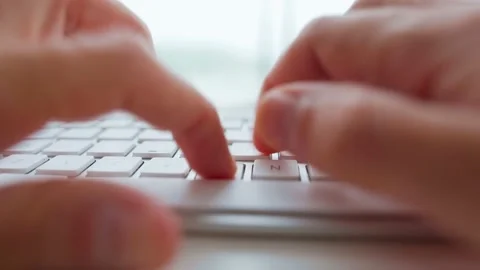 Male hands typing on a computer keyboard extreme close-up. Concept of remote Stock Footage 131378173