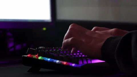 Male hands is typing on the computer keyboard, close up view. Stock Footage 234792843