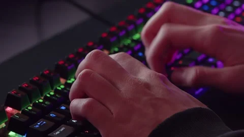 Male hands is typing on the computer keyboard, close up view. Fast typing. Stock Footage 303707311