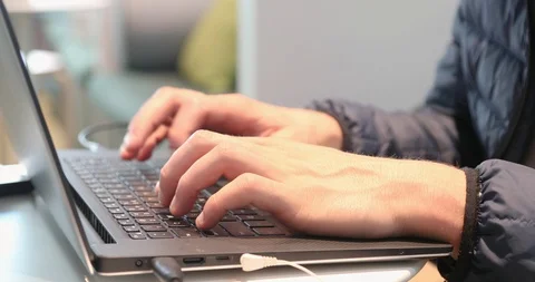 Male hands typing on laptop computer Stock Footage 89461830