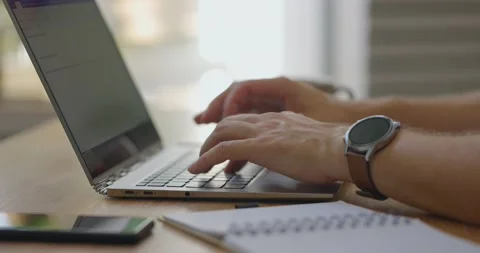 Male hands typing on personal computer.Man sitting with laptop,cup of coffee and Stock Footage 161075824