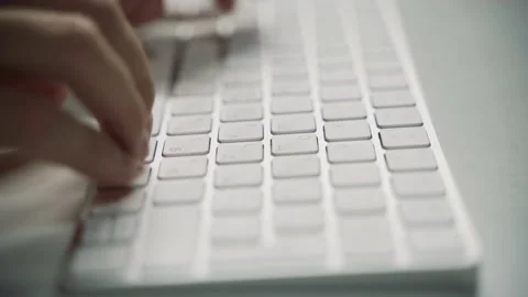 Male hands typing on a white computer keyboard Stock Footage 158891085