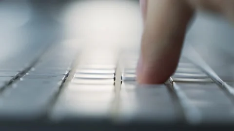 Male hands typing on a white computer keyboard. Macro. Slide zoom out. 動画素材 158891103