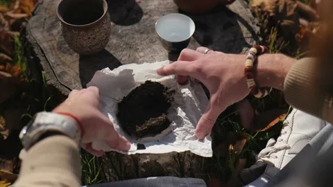 Male hands unpack pressed pu-erh. chinese tea ceremony concept Stock Footage 229857998