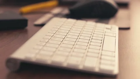 Male hands using a computer keyboard and mouse Stock Footage 133546812
