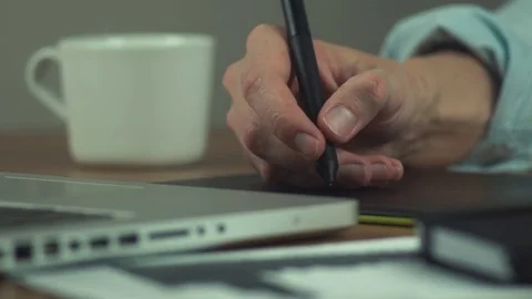 Male hands of using drawing tablet. Designer working with graphics tablet Stock Footage 81880196