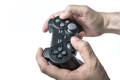 Male hands using game console controller Foto stock