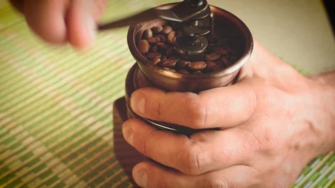 Male hands using a hand mill to grind coffee beans Stock Footage 102215186