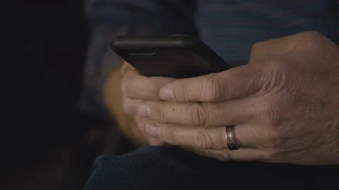 Male hands using iPhone, pressing touch buttons with both hands Stock Footage 164891073