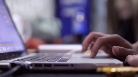 Male hands using laptop, man working behind laptop, side view, close-up Stock Footage 74431094