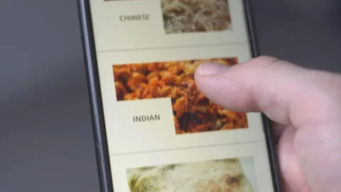 Male hands using smartphone with app delivery asian food for online order Stock Footage 170086541