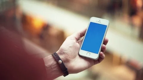 Male hands using smartphone with chroma screen in shopping mall Stock Footage 82989770