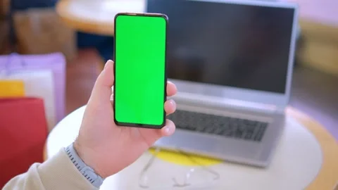 Male hands using smartphone mobile with empty green screen top view sunshine 스톡 동영상 263897805