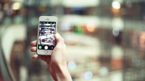Male hands using smartphone taking photo in shopping mall Stock Footage 82989863