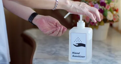Male Hands using transparent sanitizer in pump bottle Stock Footage 128409562