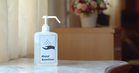 Male Hands using transparent sanitizer in pump bottle Stock Footage 128409938