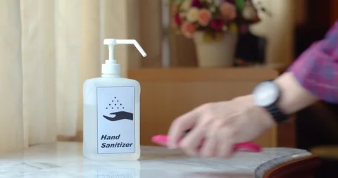 Male Hands using transparent sanitizer in pump bottle Stock Footage 128409981