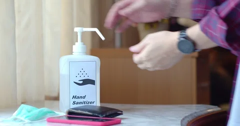 Male Hands using transparent sanitizer in pump bottle Stock Footage 128409985