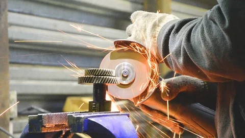 Male hands at work with an angle grinder Stock Footage 120028428