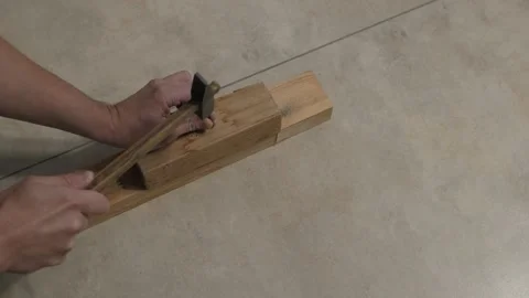 Male hands work with a hammer Vidéo 336408445