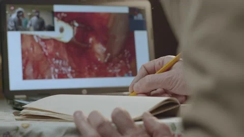Male hands write medicine notes with pencil in notepad on table. Medicine Stock Footage 195507943