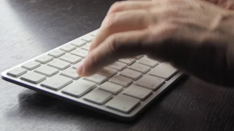 Male hands write on a white keyboard Stock-Footage 119694609