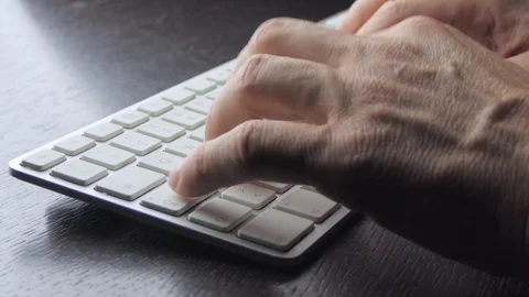 Male hands write on a white keyboard with zoom in Stock-Footage 119694636