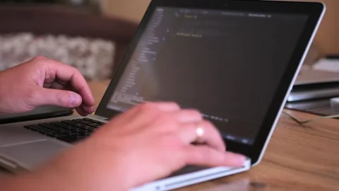 Male hands writes program code on laptop close up. Stock Footage 243583555