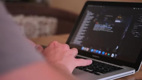 Male hands writing program codes on his computer screen close-up. Video stock 243580741