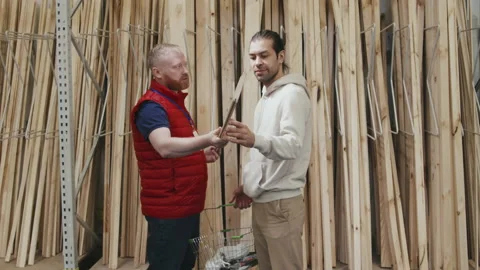 Male Hardware Store Worker Helping Customer Stock Footage 158050449
