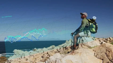Male hiker sitting while camera zooming sparking line graphs extending to hiker, Stock Footage 333975611