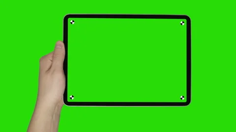 Male Holding Tablet in Landscape on Gree... | Stock Video | Pond5