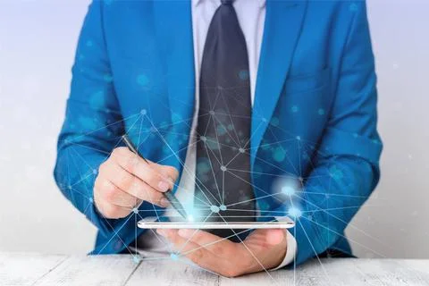 Male human presenting a presentation using the latest sophisticated device... Stock Photos