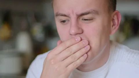 Male with increased tooth sensitivity drinking water Stock Footage 125803478