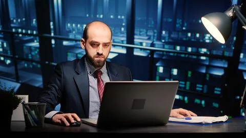 Male infrastructure engineer working in render farm Stock Photos